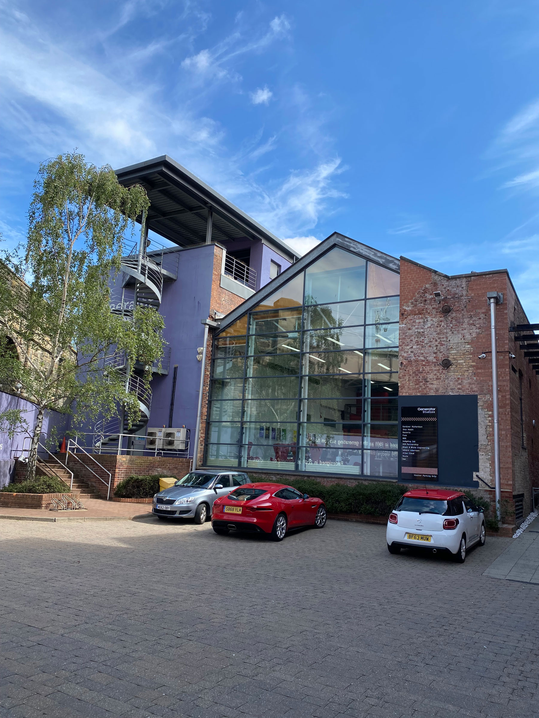 Exterior of Generator Studios, with full glass height side window